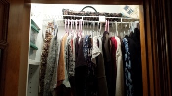 Top row of hanging clothes in my organized tiny closet.