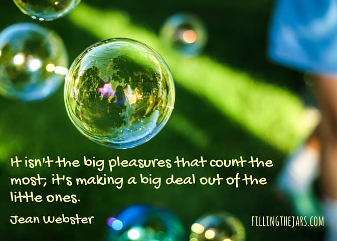 blurry summer background with soap bubbles and text overlay jean webster quote it isnt the big pleasures that count the most