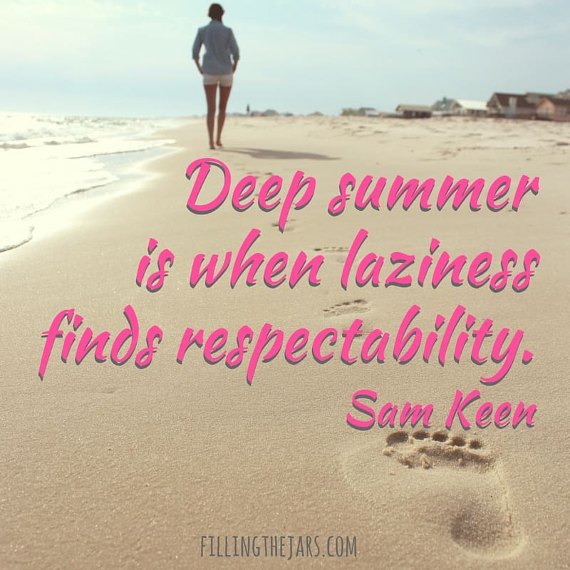 Sam Keen deep summer quote in pink text over image of woman walking away down sandy beach.