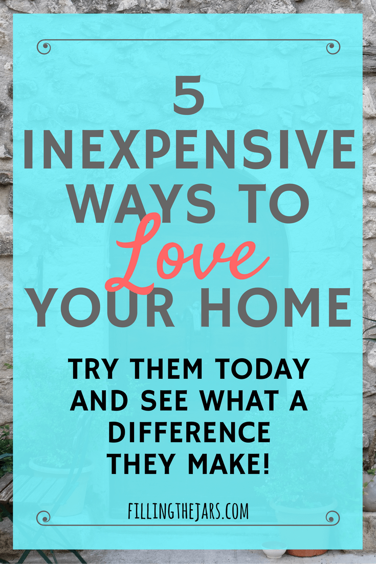 Pinterest image with text '5 Inexpensive Ways to Love Your Home' on sheer turquoise square over background of door in stone wall.