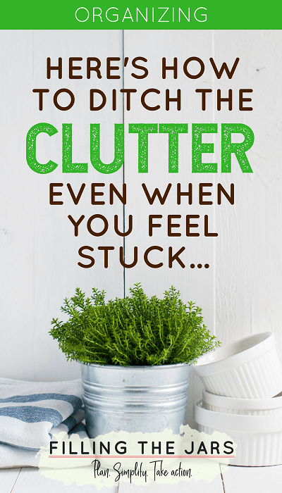 metal planter, white ramekins, and blue tea towel on white table against white wall with text how to ditch the clutter when you feel stuck