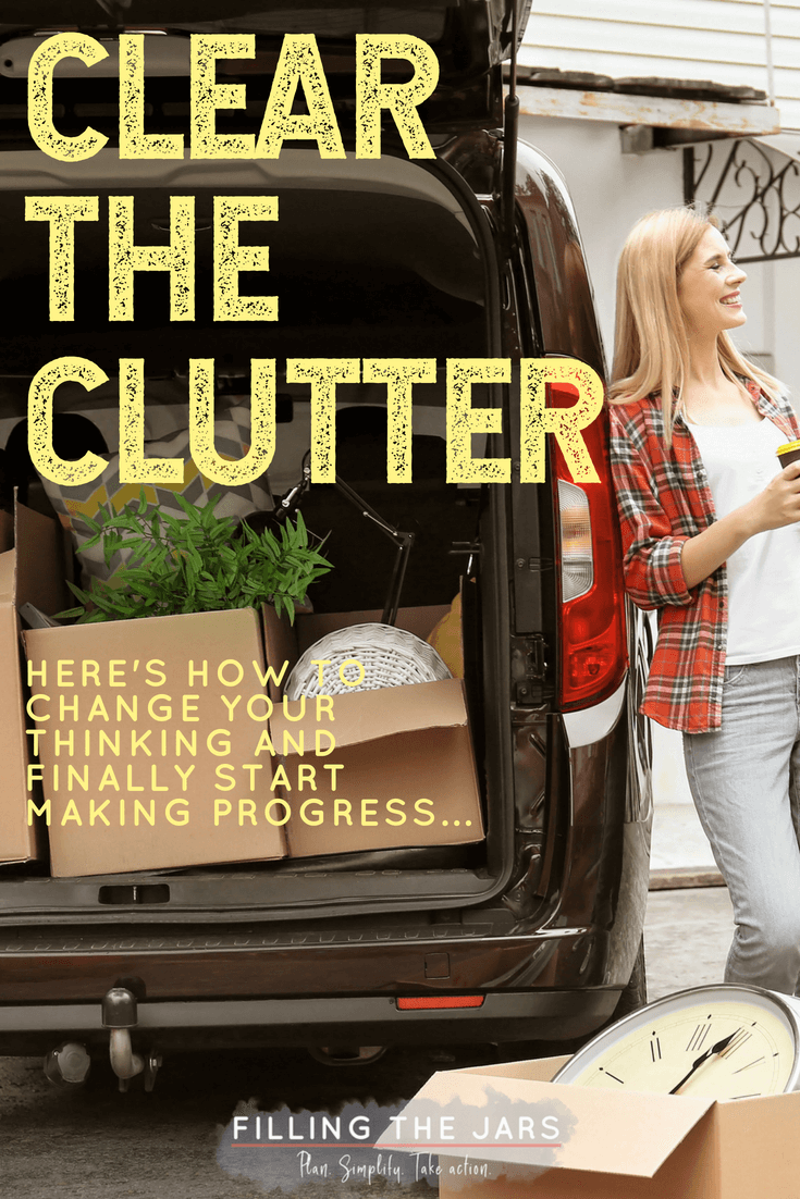 blonde woman in red plaid shirt leaning against mini-van with open rear door loaded with cardboard boxes full of items to donate with yellow text overlay clear the  clutter