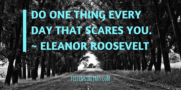 Eleanor Roosevelt motivational quote turquoise text over black and white image of road through trees