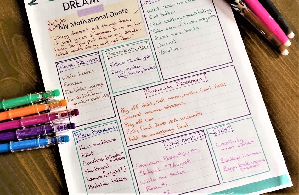 dreams and goals worksheet on table with colored pens for planning