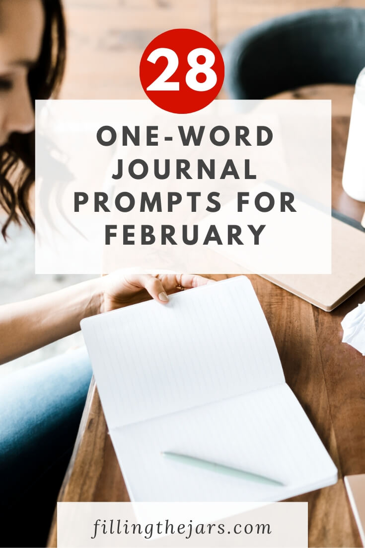 woman sitting at wooden table with open notebook getting ready to use February journal prompts