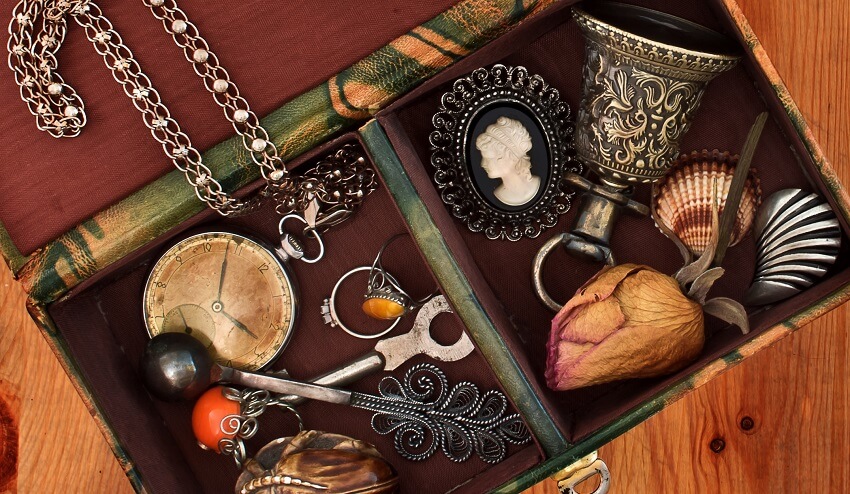 memory box of sentimental items on wood background