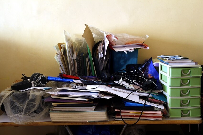 messy desk that needs to be decluttered and organized