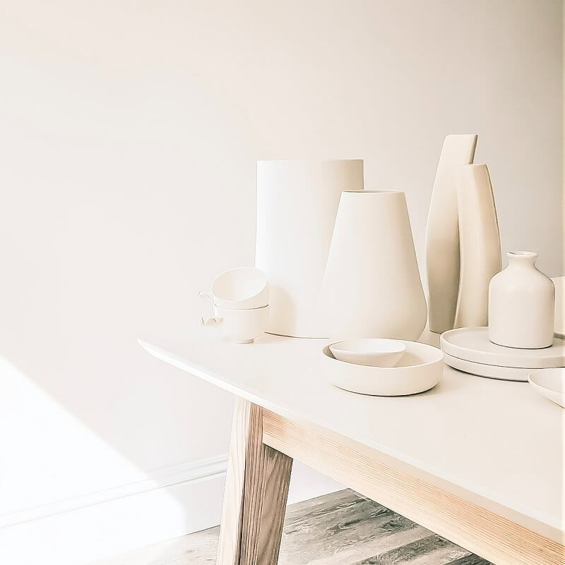 white pottery on white table in white sunlit room