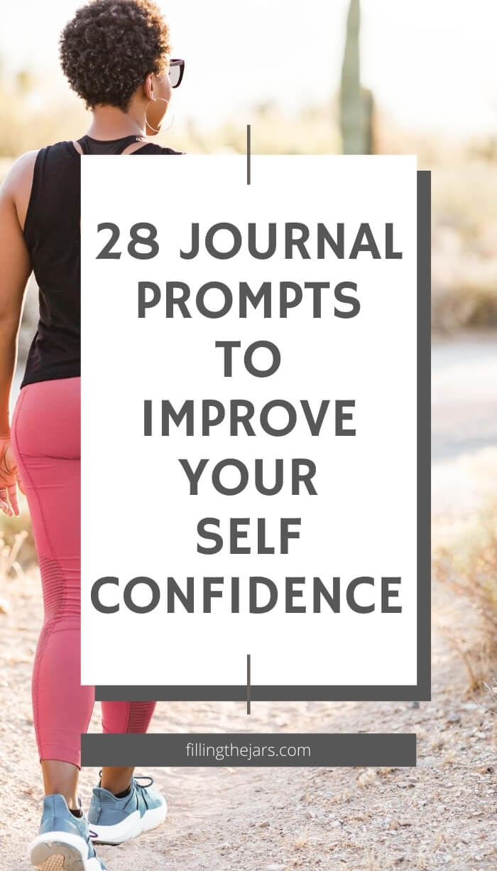 woman in black athletic top and pink leggings walking away through desert with white overlay and text journal prompts to improve confidence