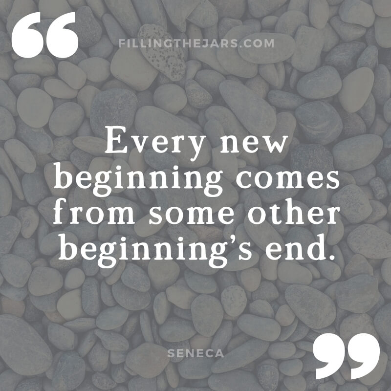 Seneca quote every new beginning in white text on dark background over image of beach pebbles