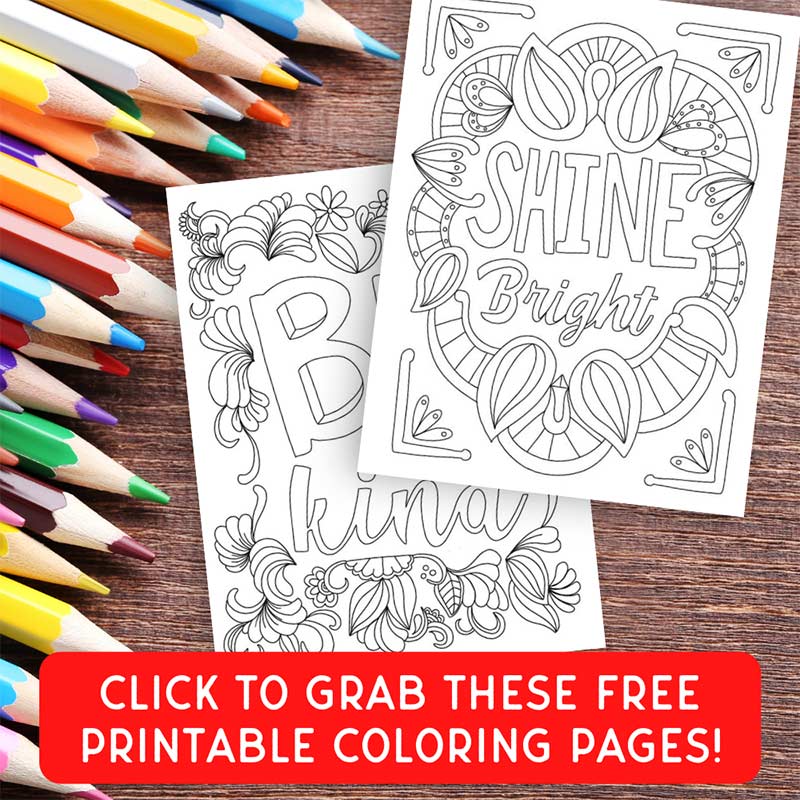 white text and coloring page images on wood background with colored pencils and red button