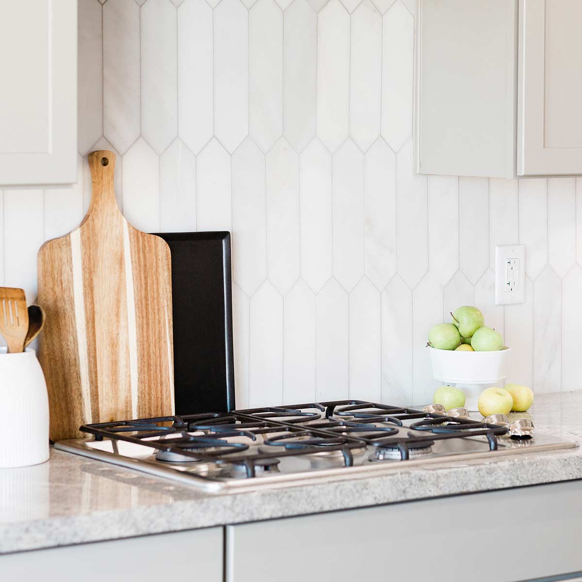 simple and clutter-free kitchen counter with white tile backsplash