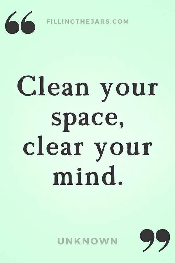 Clean your space clear your mind quote in black text on pale green background.