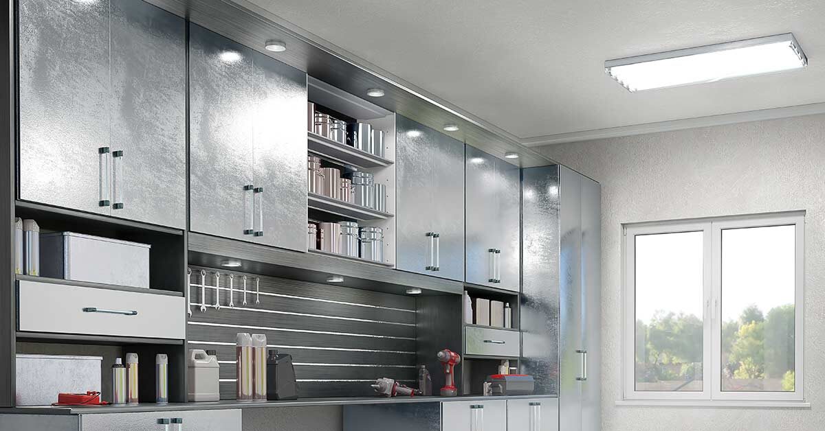 Very clean and organized garage with metal cabinets.