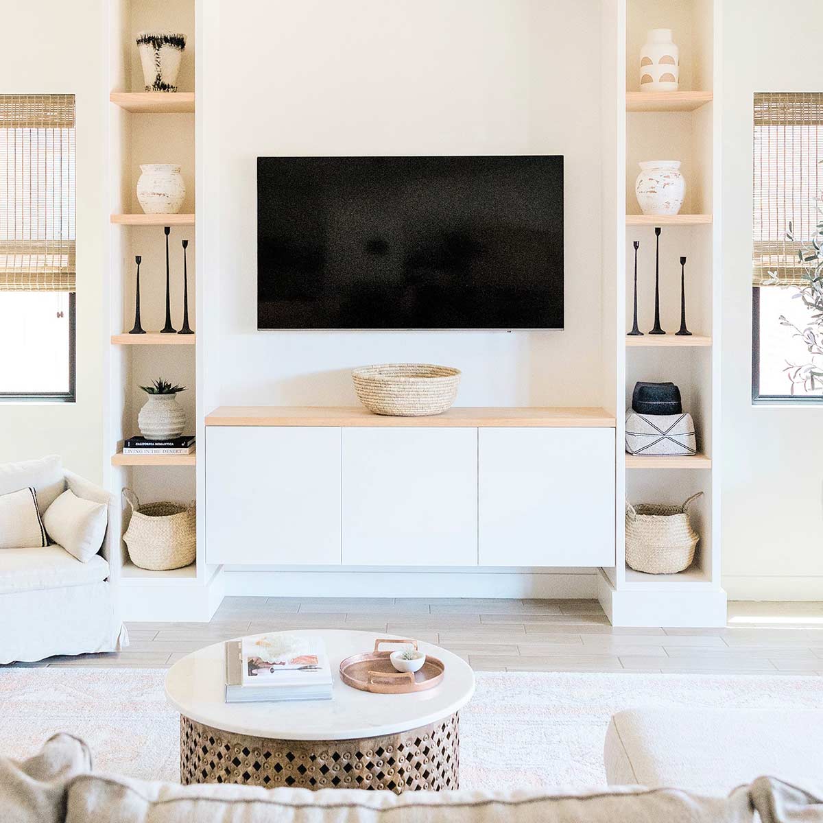 Living room with white and neutral decor looks amazing after weekend decluttering.