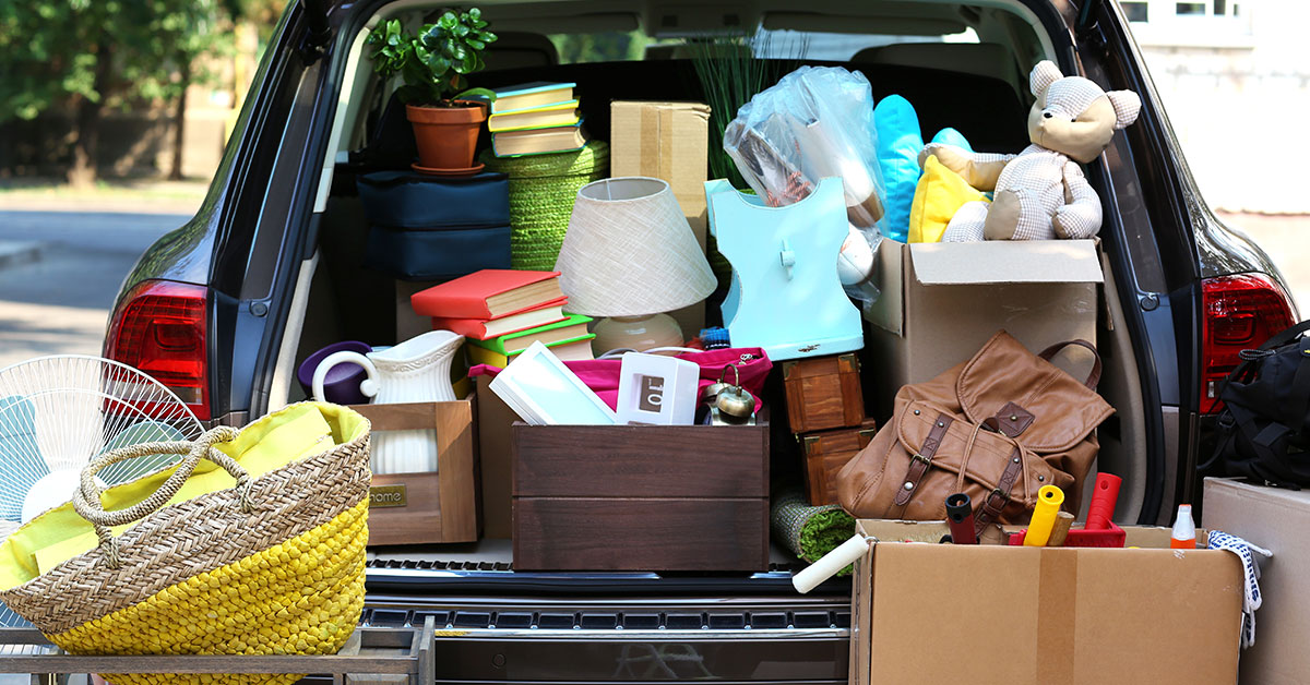 Open back of vehicle full of items to donate.