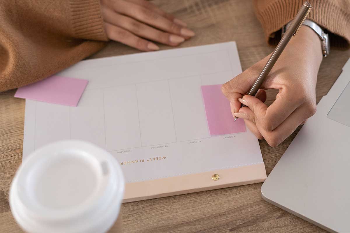 Woman making plan to declutter a small home.