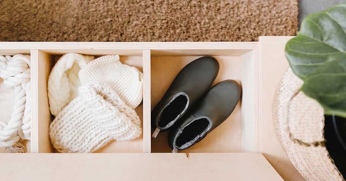 Top view of flip-top entryway bench with sections for holding boots, hats, and other items.