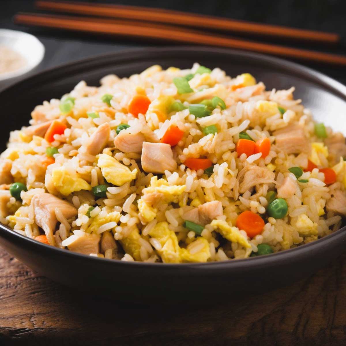 Large bowl of chicken fried rice.