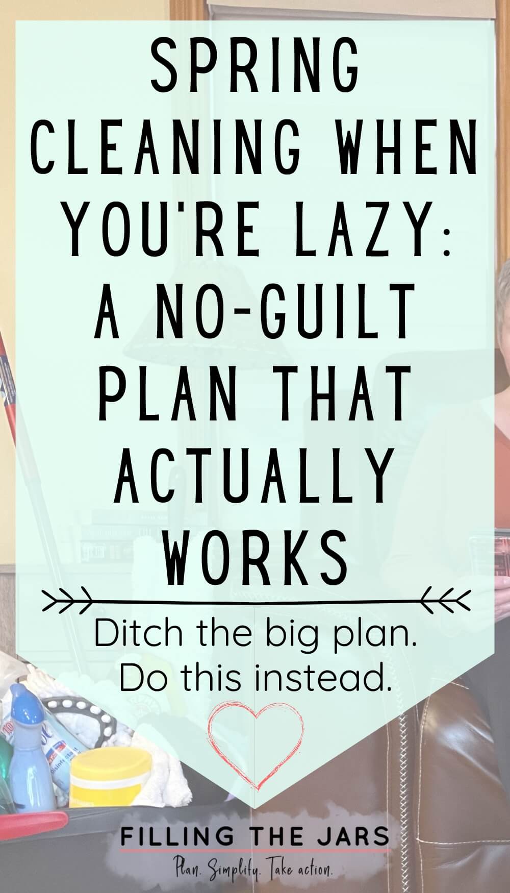 Teal banner over a living room scene with cleaning supplies visible in the background. The graphic reads ‘Spring cleaning when you're lazy: a no-guilt plan that actually works’ and ‘Ditch the big plan. Do this instead.’